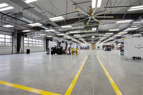 who owns caliber collision centers.